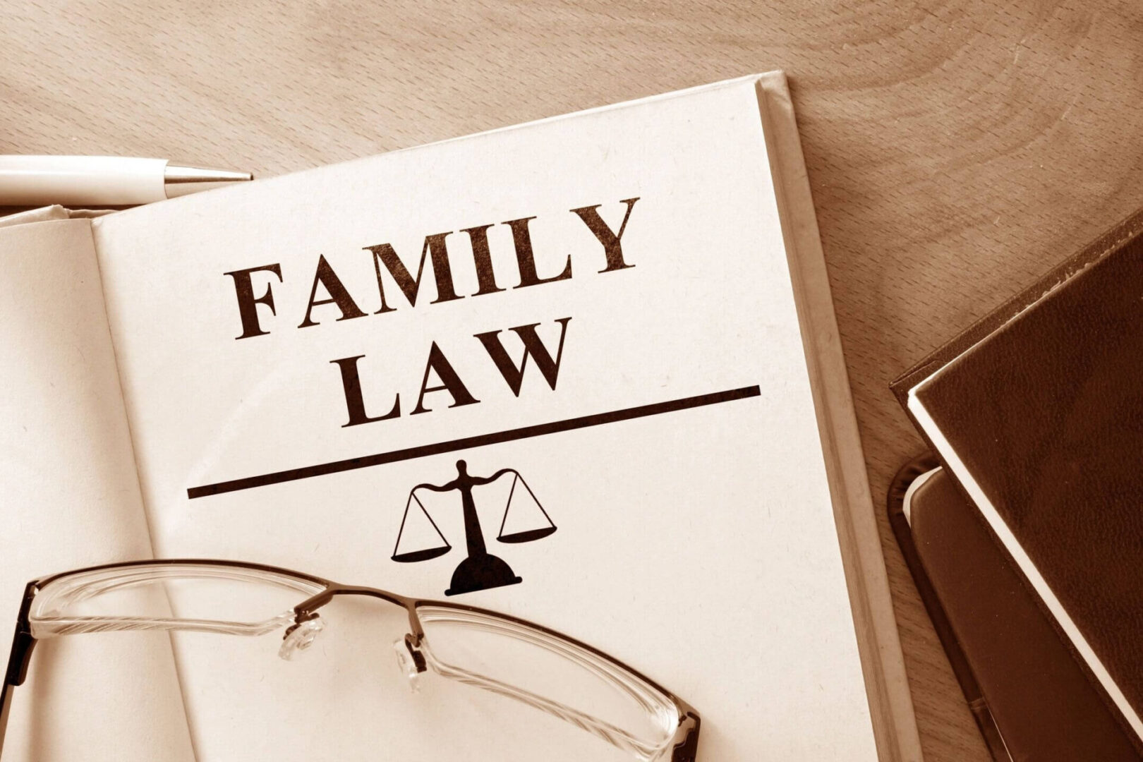 A family law book with glasses on top of it.